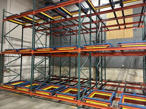 Push-back pallet racking with carts on every level