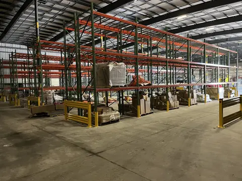 Pallet racking aisles with yellow rack guards