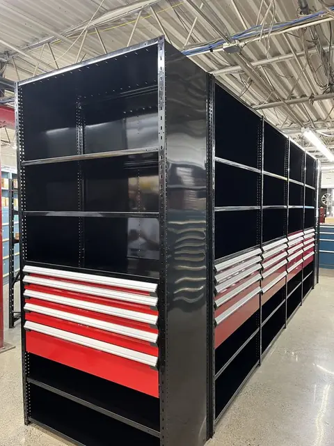 Black steel shelving with red modular drawers