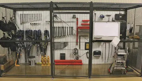 Tools stored inside a wire cage